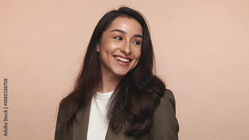 Portrait of a cheerful Hispanic woman exuding joy and confidence with a radiant toothy smile on a warm beige background. Portrait of a cheerful Hispanic woman exuding joy and confidence with a radiant toothy smile on a warm beige background.