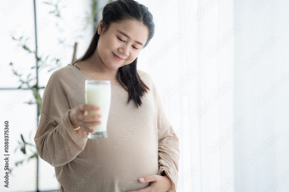 Pregnant asian woman drinking milk at home relaxation and Self-care Pregnancy drinking a glass of fresh milk mother mindfulness Positive life moment in pregnancy time Pregnant asian woman drinking milk at home relaxation and Self-care Pregnancy drinking a glass of fresh milk mother mindfulness Positive life moment in pregnancy time