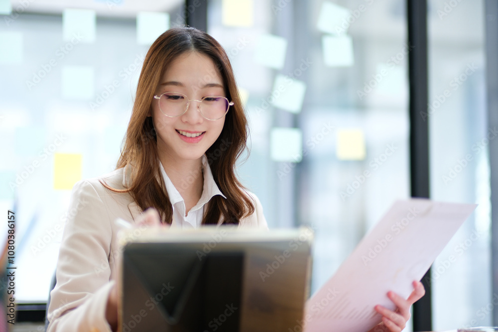 Businesswoman and entrepreneur using a tablet for data analysis and investment planning Businesswoman and entrepreneur using a tablet for data analysis and investment planning