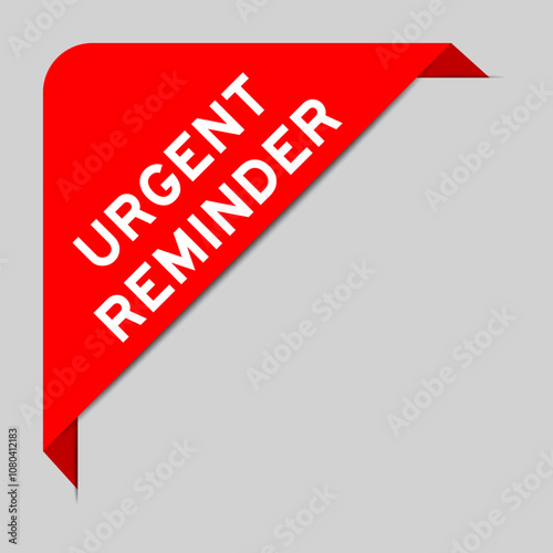 Red color of corner label banner with word urgent reminder on gray background