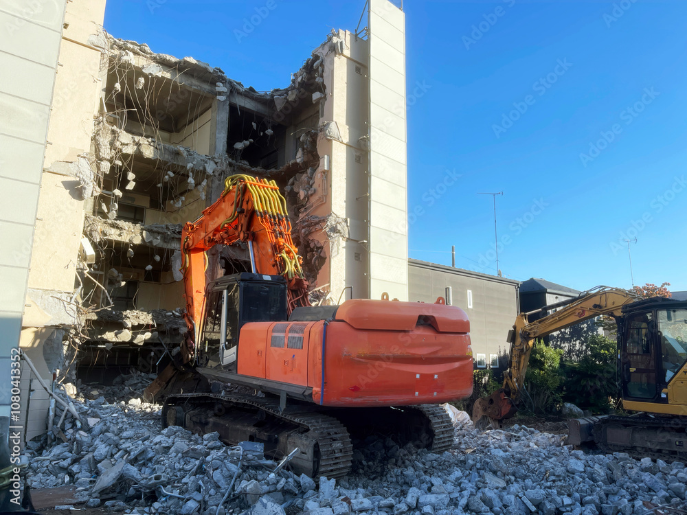 construction area with excavator destroys building construction area with excavator destroys building