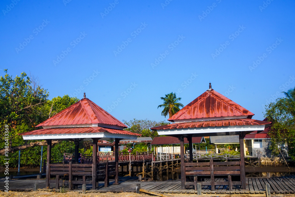 Fototapeta premium Row of gazebo tourist attractions on the river bank