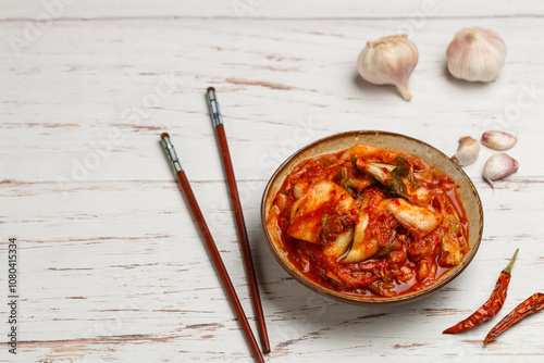 Kimchi is a dish of Korean cuisine made of cabbage and pickled (fermented) vegetables with red hot pepper and garlic. Close-up, selective focus