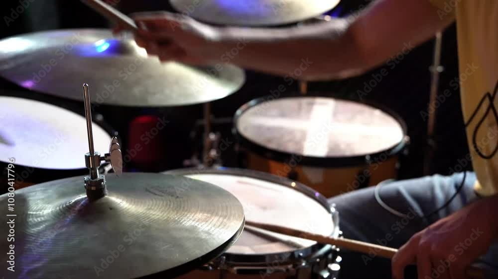 Musician plays a repetitive rhythm on a snare drum and hi-hat, creating an energetic and engaging sound Musician plays a repetitive rhythm on a snare drum and hi-hat, creating an energetic and engaging sound