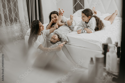 Family playing under a sheet together