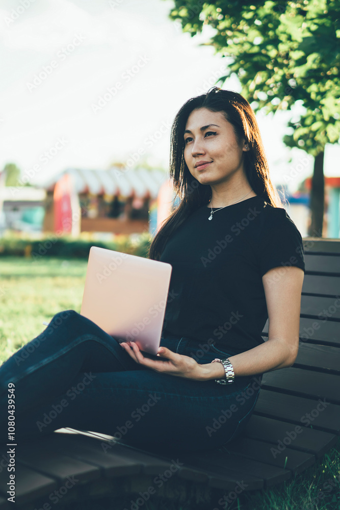 Attractive asian female digital nomad thinking about working project recreating in green park using laptop computer and 4G, skilled woman freelancer satisfied with remote job on nature in summer Attractive asian female digital nomad thinking about working project recreating in green park using laptop computer and 4G, skilled woman freelancer satisfied with remote job on nature in summer