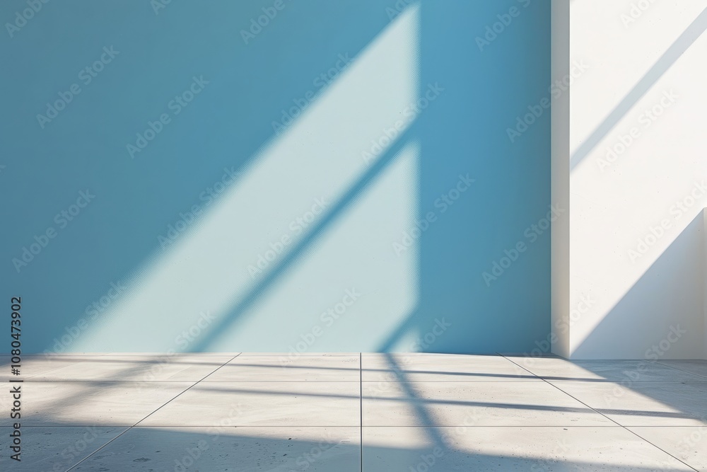 Obraz premium Minimalist interior with sunlight casting shadows on blue and white walls, creating a serene and peaceful ambiance.
