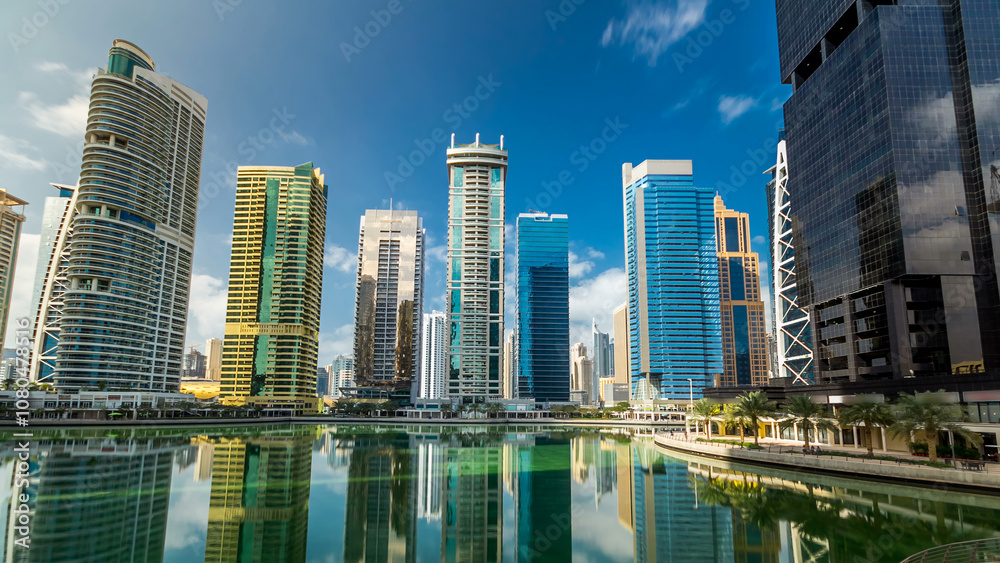 Obraz premium Residential buildings in Jumeirah Lake Towers timelapse hyperlapse in Dubai, UAE.