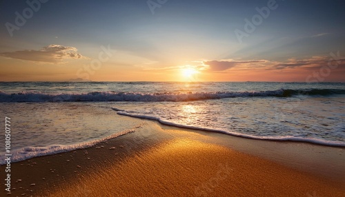 the sun sets over a tranquil beach casting a warm glow on the sand and waves