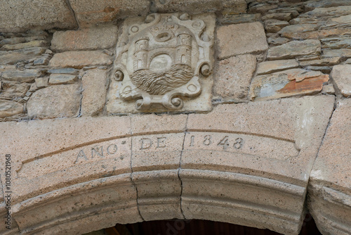 Old Heraldic Sign Over Door Arch photo