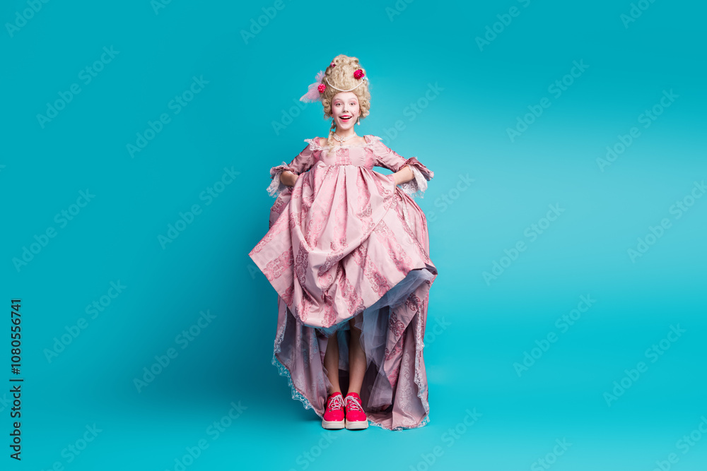 Full size photo of young aristocratic woman show shoes empty space wear baroque dress isolated on teal color background Full size photo of young aristocratic woman show shoes empty space wear baroque dress isolated on teal color background