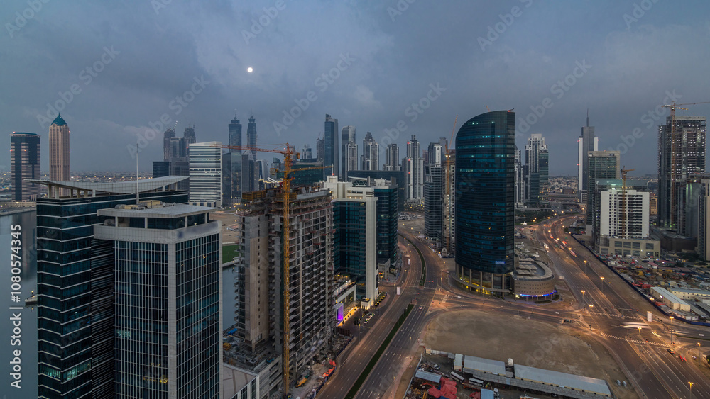 Dubai Downtown night to day timelapse. Aerial view over big futuristic city by night. Dubai Downtown night to day timelapse. Aerial view over big futuristic city by night.