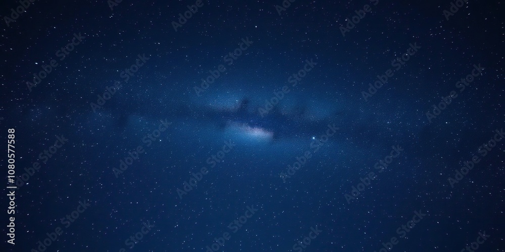 Fototapeta premium The Milky Way galaxy stretches across a dark blue sky, radiation, cosmic rays