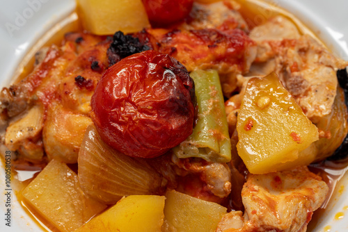 Traditional delicious Turkish dishes; potato, tomato, pepper, garlic and meat dish (Turkish name; Fırında tas kebabı,)