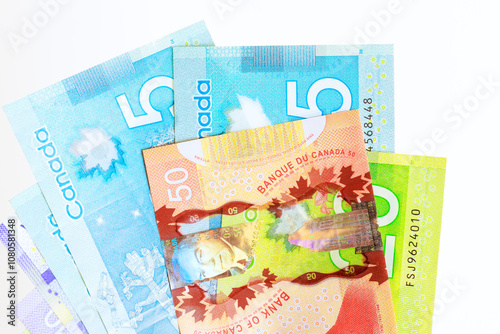 Counting Canadian dollars in various denominations banknotes cash photo