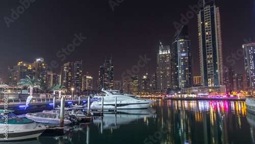 Dubai marina bay with yachts an boats night timelapse hyperlapse