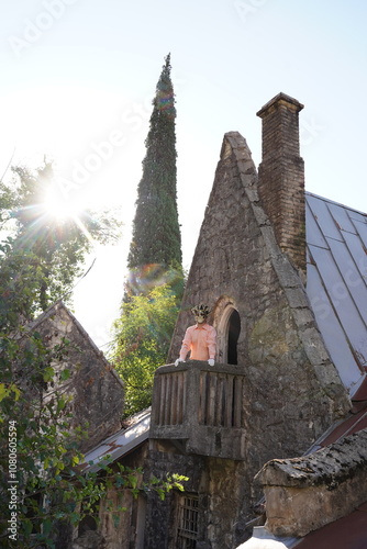 A man in a Venetian mask on Juliet's balcony in Gagra photo