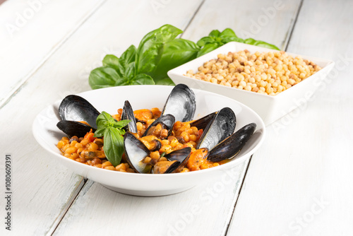 Fregula con cozze, pasta sarda, ricetta mediterranea  photo