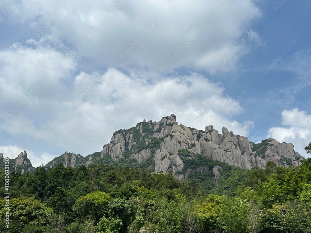Majestic Mountain Peak with Exposed Rocks in the Distance Majestic Mountain Peak with Exposed Rocks in the Distance