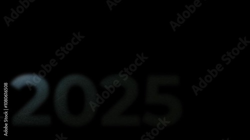 The inscription 2025, shimmering with bright colors, appearing on a black background. New Year's motive. New Year. Lettering, calligraphy. Video art graphics