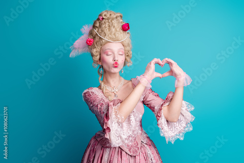 Photo of charming medieval lady marie antoinette showing heart sign isolated on blue color background
