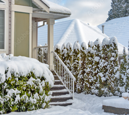 Porch and doorsteps of residential house in snow photo