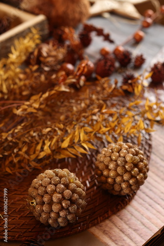 Cozy autumn decor with candles, pinecones, and berries, creating a rustic, seasonal ambiance perfect for fall. photo