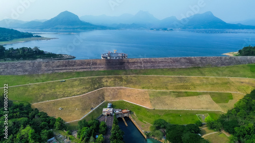 Aerial View of Jatiluhur, the Largest Dam in Indonesia. Bendungan Jatiluhur of Purwakarta. Multi-Purpose Embankment Dam on The Citarum River with Morning Glory Spillway photo