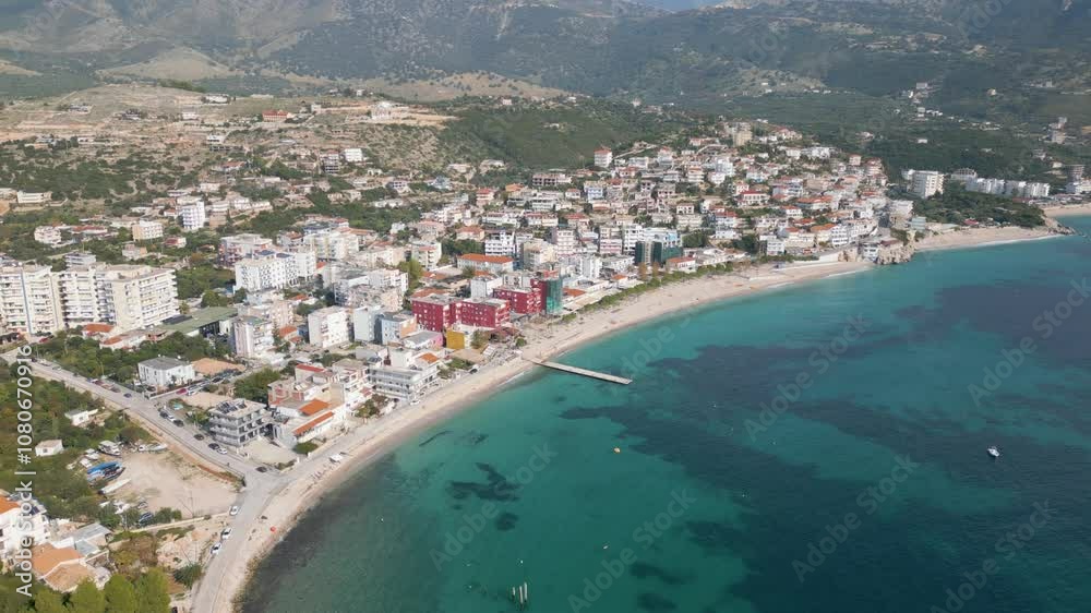 Aerial drone photo of the holiday destination of Himarë in Albania with a bay and beach. Aerial drone photo of the holiday destination of Himarë in Albania with a bay and beach.