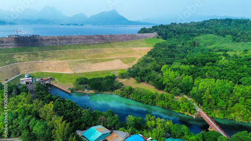 Aerial View of Jatiluhur, the Largest Dam in Indonesia. Bendungan Jatiluhur of Purwakarta. Multi-Purpose Embankment Dam on The Citarum River with Morning Glory Spillway photo