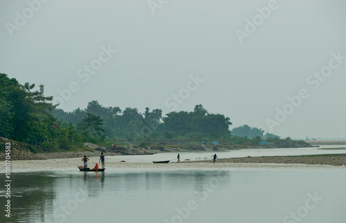 Rowing across a river in a country boat