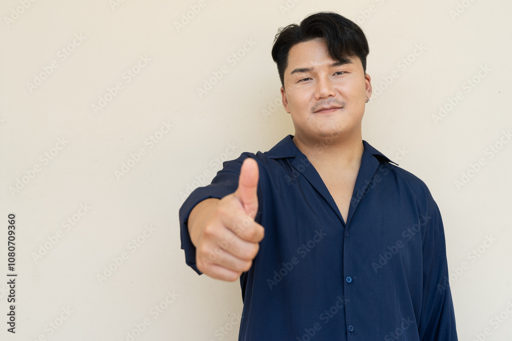 Portrait of Handsome Young Asian Man Against Plain Background Portrait of Handsome Young Asian Man Against Plain Background