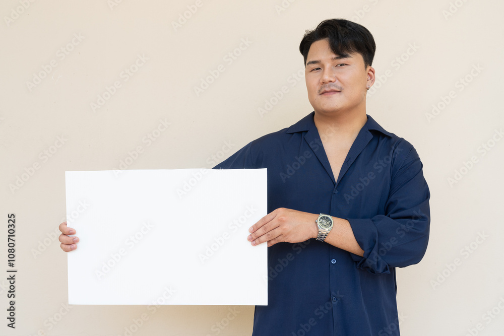 Portrait of Handsome Young Asian Man Against Plain Background Portrait of Handsome Young Asian Man Against Plain Background
