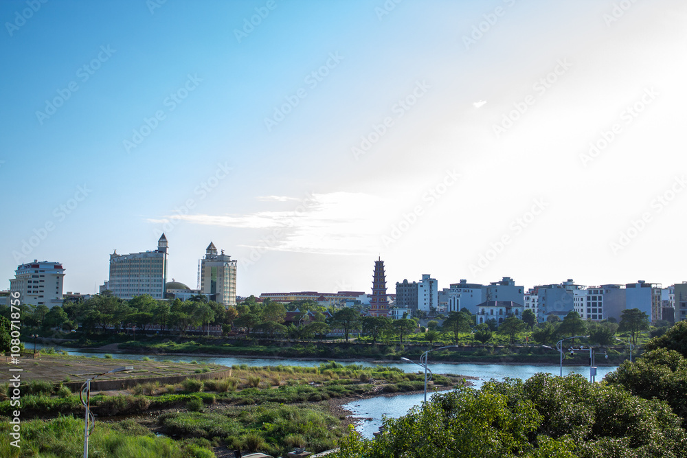 a city with a river and trees and a bridge in the background. a city with a river and trees and a bridge in the background.