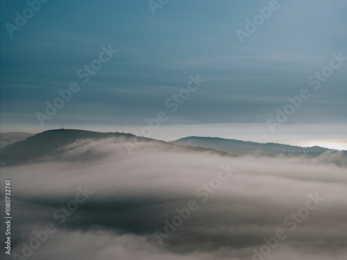 Fog and clouds over the mountains of the island in the sea