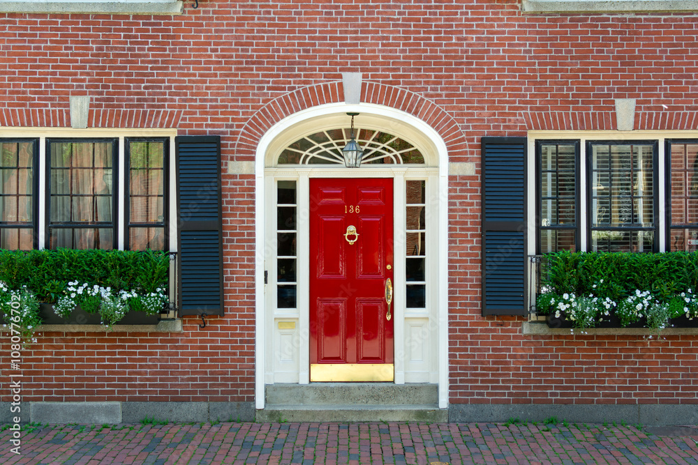 Beautiful red door on charming brick house, Boston, Massachusetts, USA Beautiful red door on charming brick house, Boston, Massachusetts, USA