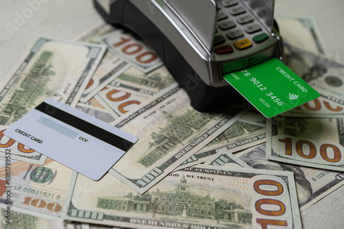 portrait of 100 US dollar banknote, credit card and EDC machine, advertisement and copy space, isolated on grey background.