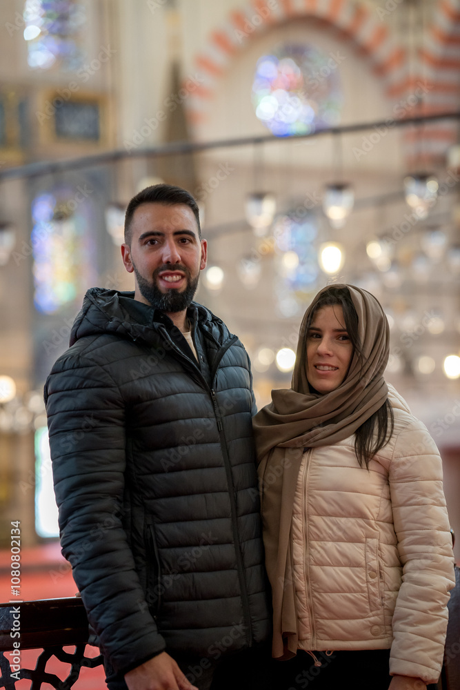 Close-up of tourist couple inside Istanbul mosque sightseeing Close-up of tourist couple inside Istanbul mosque sightseeing