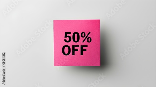 Black '50% OFF' Text on a Fuchsia Square Paper Note. White Background with Copy Space