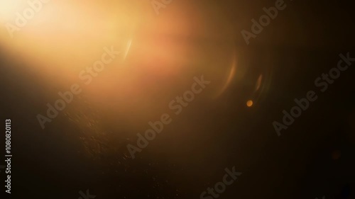 Play of golden sunlight with dramatic lens flare creates ethereal atmospheric background. Warm amber and sepia tones produce dreamlike cinematic mood. Overlay texture.
