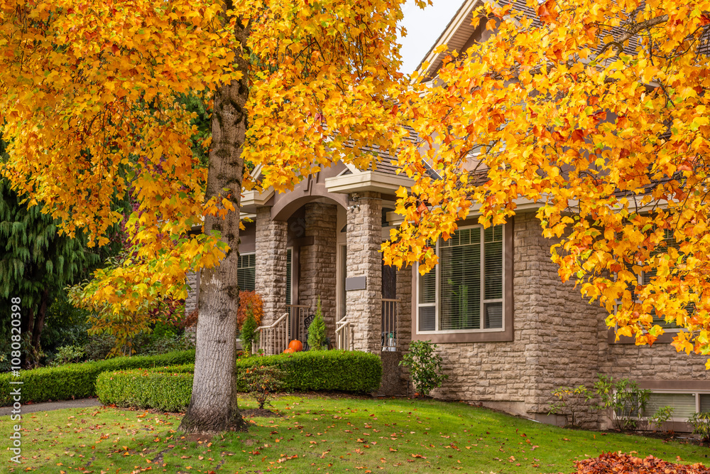 Fragment of luxury house in fall with green trees and nice landscape in Vancouver, Canada, North America. Day time on November 2024. Fragment of luxury house in fall with green trees and nice landscape in Vancouver, Canada, North America. Day time on November 2024.
