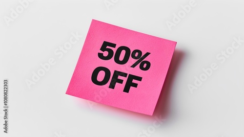 Black '50% OFF' Text on a Magenta Square Paper Note. White Background with Copy Space