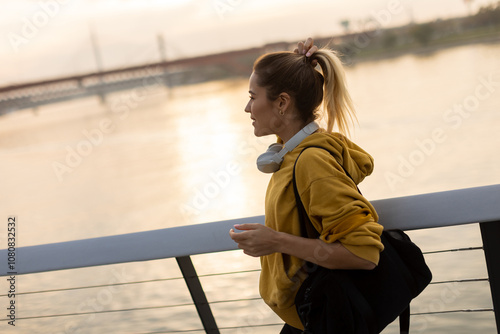 A joyful woman strolls alon...