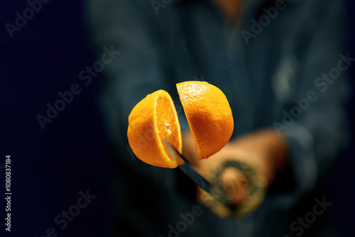 Katana cuts an orange in the air