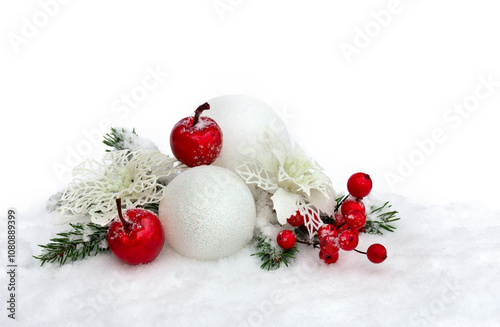 Christmas decoration. Twigs christmas tree, red berries, apple and white balls, white openwork poinsettia flowers on snow with space for text