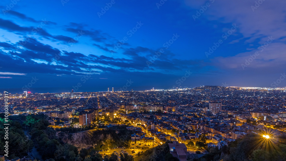 Obraz premium Panorama of Barcelona night to day timelapse, Spain, viewed from the Bunkers of Carmel