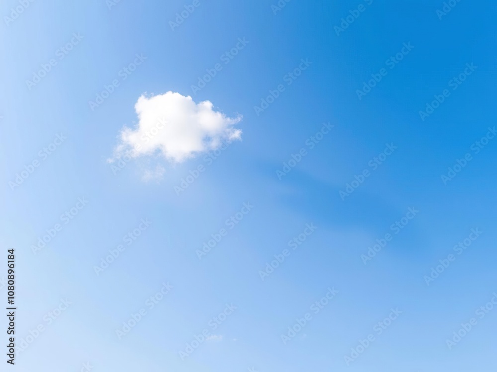 A serene blue sky with a single, puffy white cloud drifting lazily across the horizon, sunny, landscape, atmospheric perspective A serene blue sky with a single, puffy white cloud drifting lazily across the horizon, sunny, landscape, atmospheric perspective