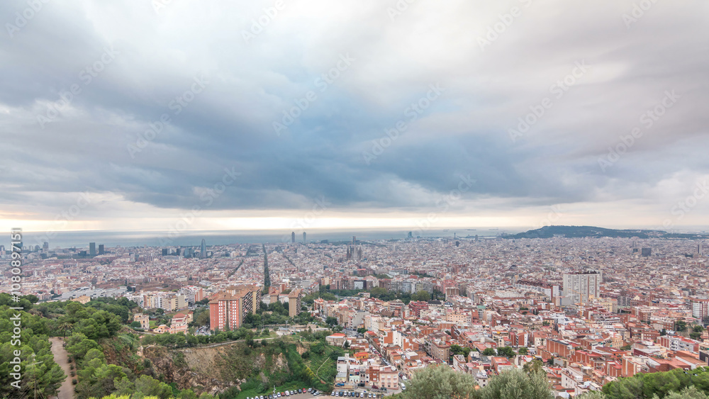 Fototapeta premium Panorama of Barcelona timelapse, Spain, viewed from the Bunkers of Carmel
