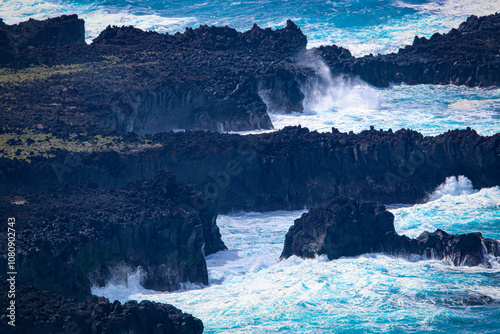 Rocky coast with big waves on Sao Miguel coast photo