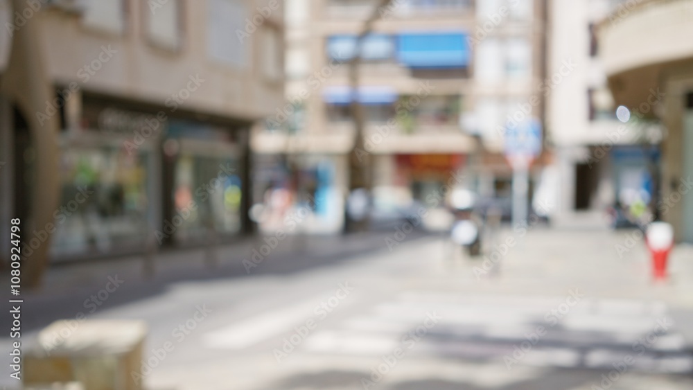 Blurred background of a city street with out of focus buildings and a bokeh effect in an outdoor setting Blurred background of a city street with out of focus buildings and a bokeh effect in an outdoor setting